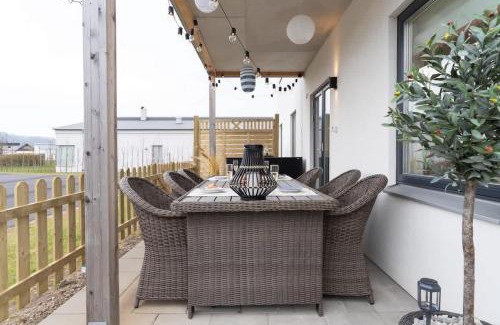 Bastad House | Modern Ground Floor Corner Flat with Rustic Patio