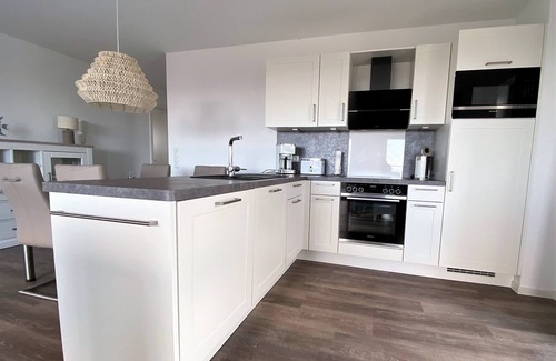 Schillig Apartment | Modern, high-quality vacation apartment, sauna, large balcony, sea view, close to the beach