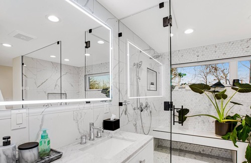 Milton House | Modern home with outdoor fireplace, rock-wall, & walk-in shower
