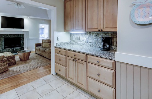 West Beach Condo | Modern, one-level condo near beach & golf with deck, sunroom, & pool