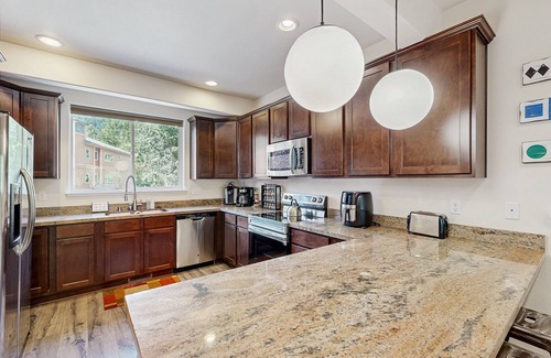 Alyeska House | Modern riverfront condo with hot tub, entertainment & river views