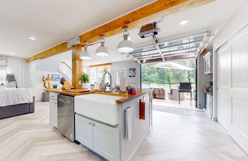 Gold Bar House | Modern riverfront home with hot tub, gas grill and patio