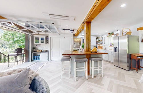 Gold Bar House | Modern riverfront home with hot tub, gas grill and patio