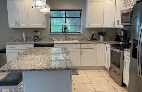 Palm Coast House | MODERN* SALTWATER HEATED POOL*CLOSE to BEACH,GOLF,AND BIKE PATHS*DOG FRIENDLY