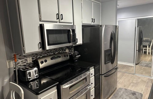 South Wrigley Condo | Modern spacious condo with nice sized balcony mountain view a 2 parking spaces
