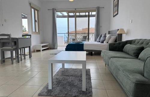 Peyia Town Apartment | Modern Studio with Pool and Balcony Hillside and Sea Views