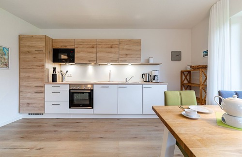 Greetsiel Apartment | Modern "Stuuv" vacation apartment with a view of the Greetsiel twin mills