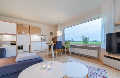 Greetsiel Apartment | Modern "Stuuv" vacation apartment with a view of the Greetsiel twin mills