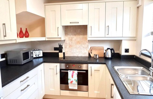 Thatto Heath Apartment | Modern, two bedroom property. Free on-site parking