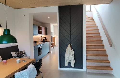 Hohwacht Apartment | Modern two-story apartment with rooftop terrace.