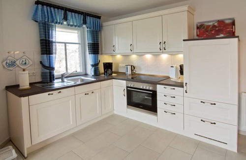 Dornumersiel Apartment | Modern upper apartment Annegret on the canal
