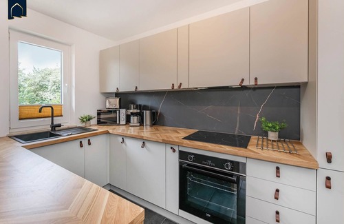 Koelpinsee Apartment | Modern vacation apartment close to the beach & family-friendly with balcony, including local