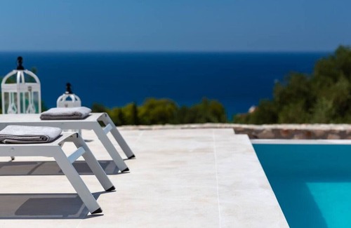 Mousata House | Modern villa in Lourdas with infinity pool and panoramic sea views