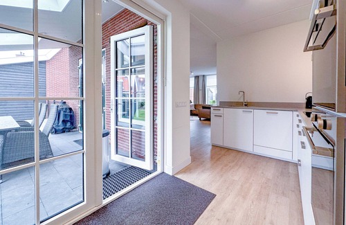 Colijnsplaat House | Modern villa with a sauna, hot tub, and a garden