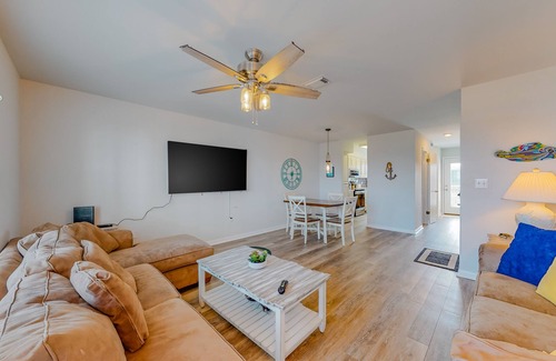 Gulf Shores Condo | Modern waterfront condo with balcony & outdoor pool - beach across the street