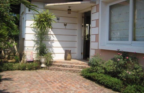 Tay Ho House | Modern Western breezy tropical villa by Red River and West Lake, Hanoi.