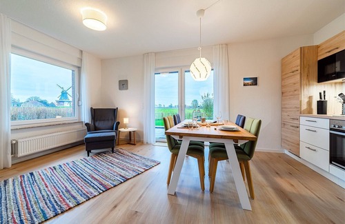 Greetsiel Apartment | Moderne Ferienwohnung "köken" mit Blick auf die Greetsieler Zwillingsmühlen
