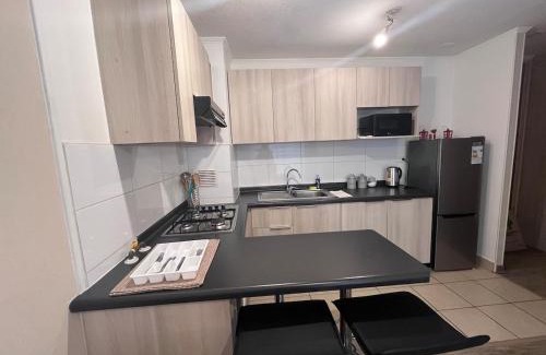 Coronel Apartment | Moderno departamento con WiFi, y estacionamiento en Coronel