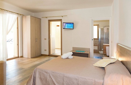 San Teodoro House | MOLAROTTO CAMERE CON ANGOLO COTTURA