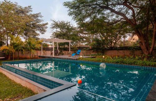 Nashik Villa | Morning Dew Retreat by StayVista - Modern interiors, Indoor games, Lush greenery, Pool & Gazebo await your escape