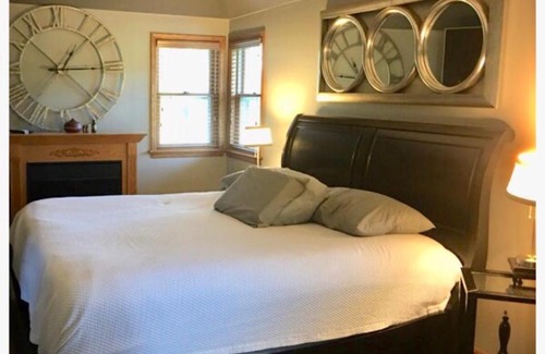 Fond du Lac House | Most Fun Home in Wisconsin: Indoor Heated Pool, Basketball Court, Rock Climbing Wall, Ropes/Obstacle Course, Play-Set, Trampoline, Fire-Pit, Grill, Patio, 84 inch TV, and so much more!