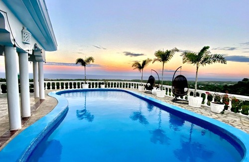 Cabrera Apartment | Mountain view suite with balcony, pool, sitting area, & more- close to beach!n