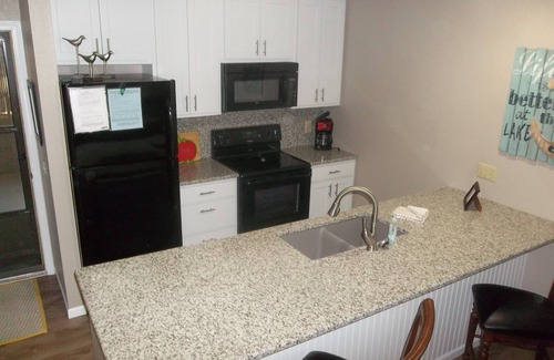 Lake Ozark Condo | Must see! Beautiful updated condo! Few steps to condo & docks! Electric Grill!