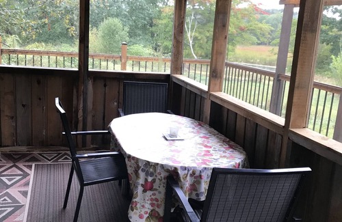 Milford Cottage | Nature Lover's Cottage Retreat On The Black River With Private Dock.