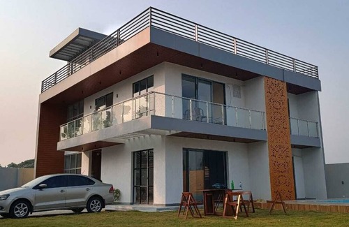 Kolkata Villa | Nature Villa With Grand Pool with four double bed rooms.