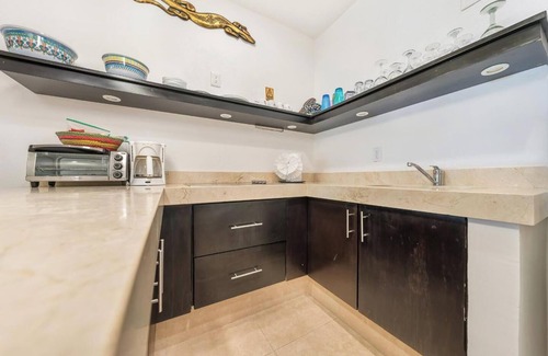 Isla Mujeres Condo | Nautibeach Condo 4 offers patio living, pool and beach access