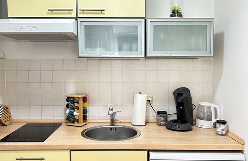 Munchen District Apartment | nCozy apartment just 25 min away from Munich and a15-min walk to Campeon Park.