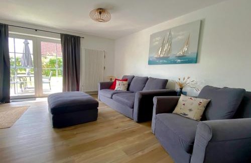 Neßmersiel Apartment | Nessmersiel, Renovierte Erdgeschosswohnung mit Garten in Deichnähe, Wallbox, Bettwäsche inklusive