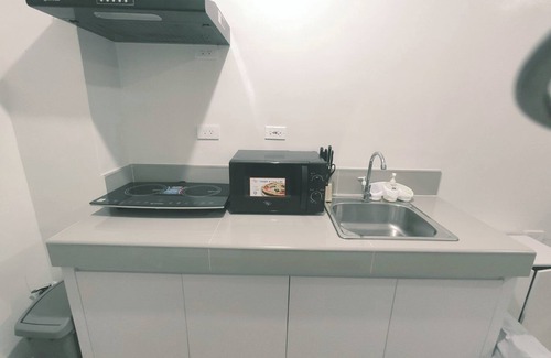 Novaliches Condo | Netflix+ Games+ Cooking+ Karaoke+ Wifi 1 BR Condo in Daily Relax Trees Residence