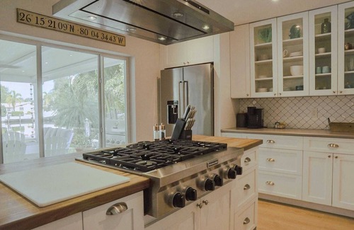 Cypress Lakes House | New! Amazing Waterfront Island Breezes - Heated Pool, Dock!
