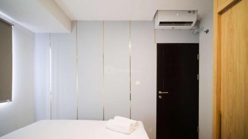 Sidoarjo Apartment | New and Homey 2BR Apartment at Suncity Residence By Travelio