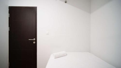 Sidoarjo Apartment | New and Homey 2BR Apartment at Suncity Residence By Travelio