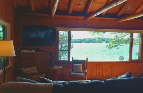 Omena House | New! Beautiful Sunset Views from this wonderful log home with Kayak, Firepit
