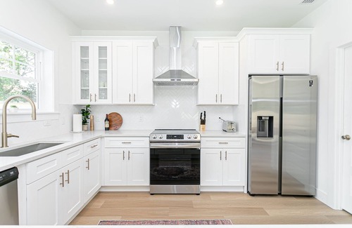 Vilano Beach House | New Luxury heated pool home, steps to the beach with two master suites!