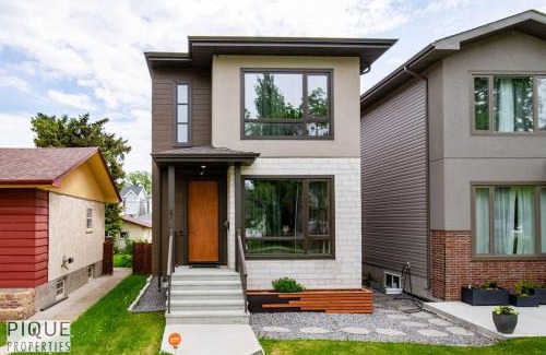 West Edmonton Apartment | NEW Modern Home - Sleeps 8 - Foosball - Deck & BBQ