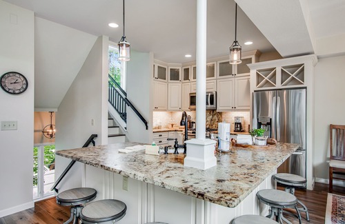 Eagle River Condo | Newly-built condo on Duck Lake with decks, private dock, & firepit