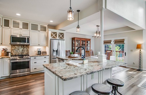 Eagle River Condo | Newly-built condo on Duck Lake with decks, private dock, & firepit