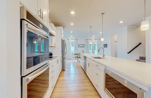 Ocean City House | Newly built row-end townhome with water view, pool access, patio, & balcony