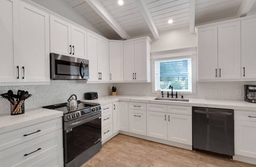 Holmes Beach House | Newly Remodeled and So Close to the Beach! Turf Yard! Pet Friendly!