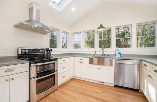Lake Township House | Newly remodeled lake house with amazing views, dock, firepit & vibrant interior