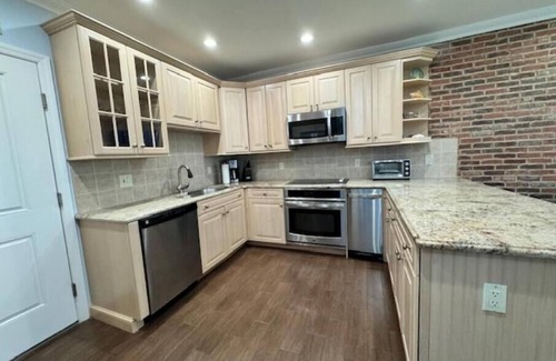 Normandy Beach Condo | Newly Renovated, Beachfront Family Oasis with Private Guarded Beach and Pool