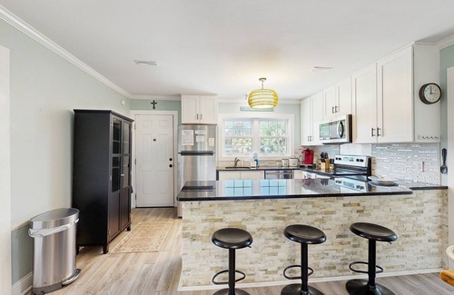 Edisto Island House | Newly renovated lagoon-view home with screen porch & patio - short walk to beach