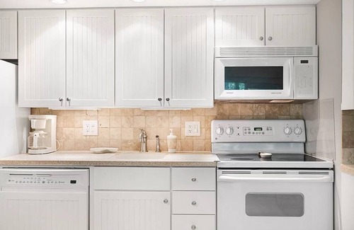 West Beach Condo | Newly Renovated Villa Steps From the Beach!