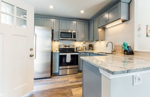 Midtown Ocean City Apartment | Newly-renovated, waterfront retreat w/a furnished deck - walk to the beach