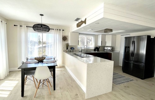 New Smyrna Beach House | Newly-updated spacious pool townhome, steps to beach - bring your boat!