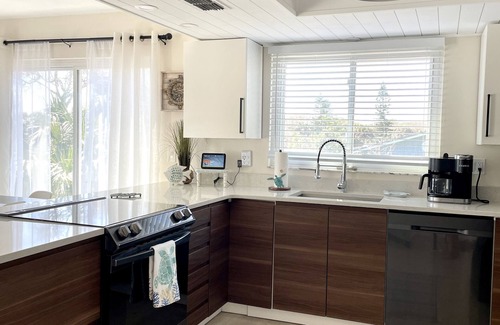 New Smyrna Beach House | Newly-updated spacious pool townhome, steps to beach - bring your boat!